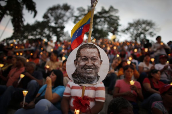People hold candles during a praying ceremony for the health of Venezuelan President Hugo Chavez in Caracas